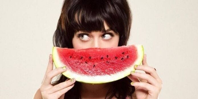 Girl with watermelon on watermelon diet